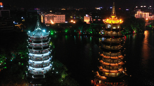 4k高清航拍桂林旅游著名景点日月双塔古建筑夜景94秒视频