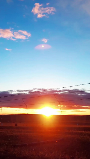 60帧延时拍摄鄂尔多斯草原地平线上日落的景象天空空镜39秒视频