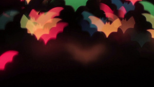 彩色蝙蝠在黑色背景HD1920上的运动动画7秒视频