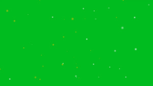 模糊银色和金色的小雪在绿色屏幕背景上飞散褪色的抽象20秒视频
