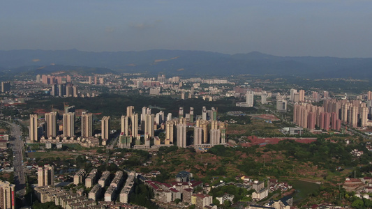 航拍被山包围的城市湖南湘西怀化城市全景视频