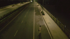 航拍城市夜景道路行走的路人28秒视频