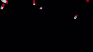 飞行红色和白色药丸的超级慢动作拍摄他们从上面掉下来24秒视频