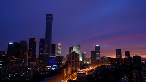北京人民日报大楼与CBD城市的红霞17秒视频