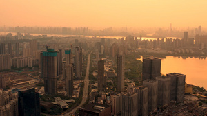 航拍夕阳下的武汉武昌城区和远眺长江大桥35秒视频