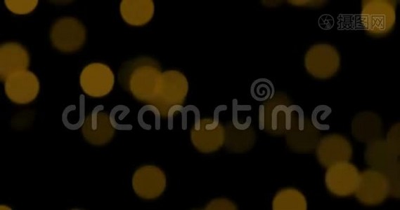 圣诞节金色渐变闪耀黑色背景的尘埃粒子，金色的节日快乐视频
