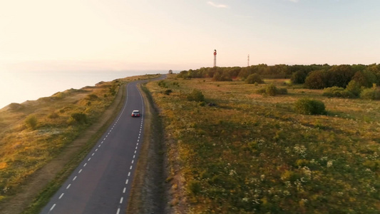 汽车自驾游行驶在海岸马路上视频