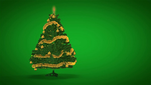 在绿色背景上旋转金色圣诞树15秒视频