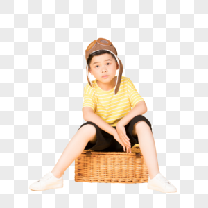 坐在行李箱上戴着飞行帽的小朋友图片