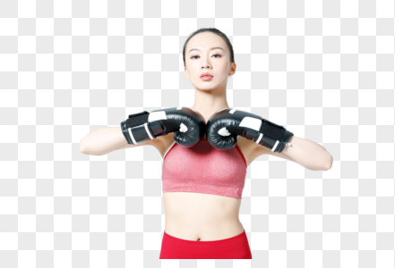 健身女性戴拳击手套展示动作图片图片