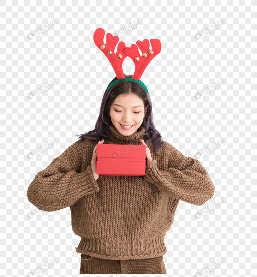 手拿礼盒带着鹿角的圣诞女性人像图片图片