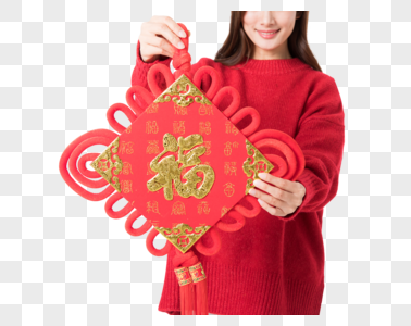 新年女性拿红色中国结图片