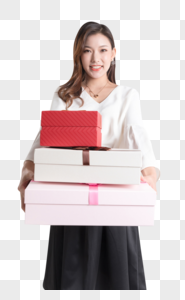 年轻女性抱着礼物盒图片图片