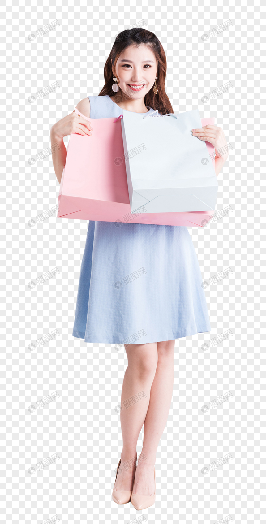 购物女性拿着购物袋做展示动作图片图片