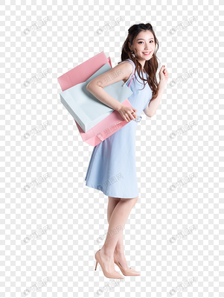 购物女性拿着购物袋做展示动作图片