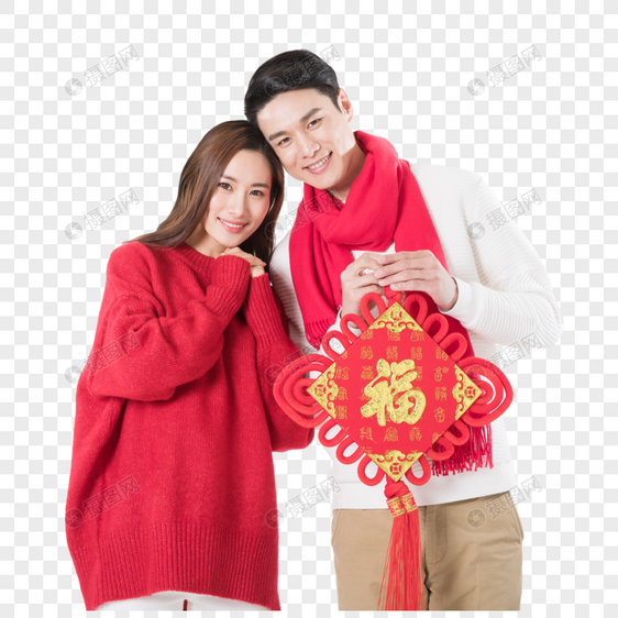 年轻夫妻拿着新年中国结图片