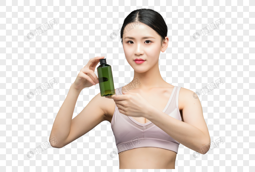 性感美女手持精华乳液瓶装图片