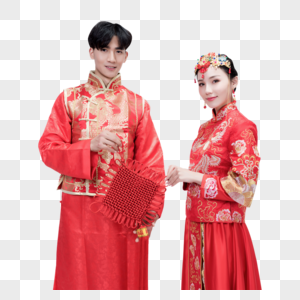 穿红装的情侣手持中国结高清图片
