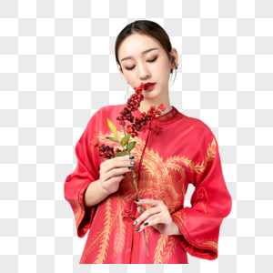 身着红装的美女手持梅花高清图片