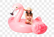 穿粉色比基尼的可爱美女坐在火烈鸟游泳圈图片