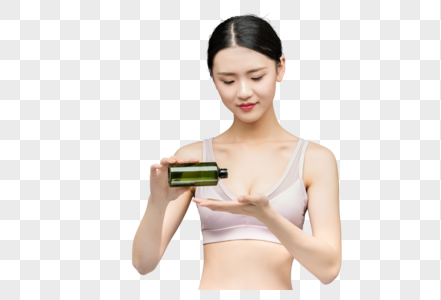 性感美女手持精华乳液瓶装高清图片