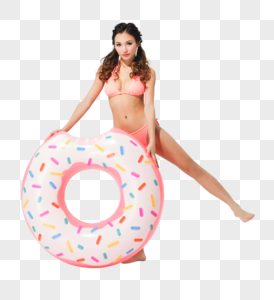 美女穿粉色比基尼的可爱女生拿着甜甜圈泳圈图片