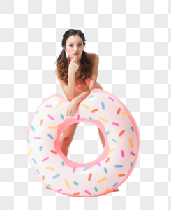 美女穿粉色比基尼的可爱女生拿着甜甜圈泳圈图片