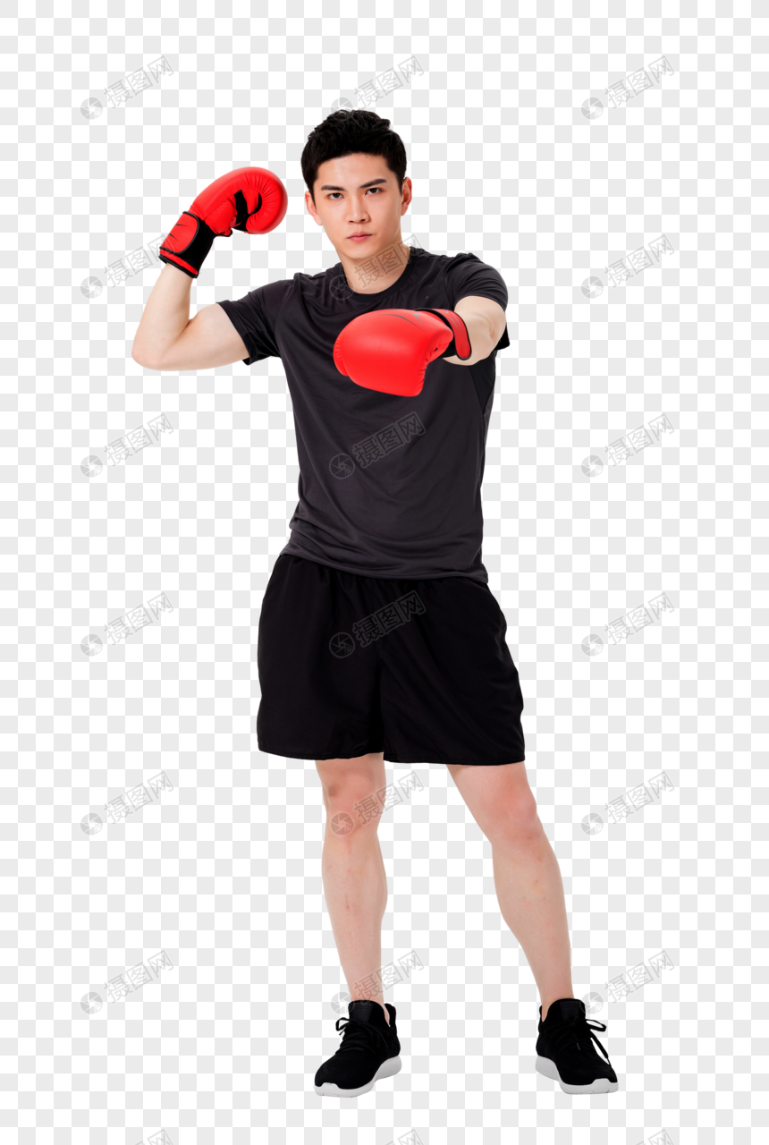 健身男性戴拳击手套打拳出拳图片