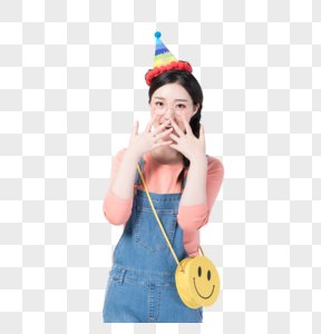 戴着生日帽微笑庆祝的青年女性高清图片