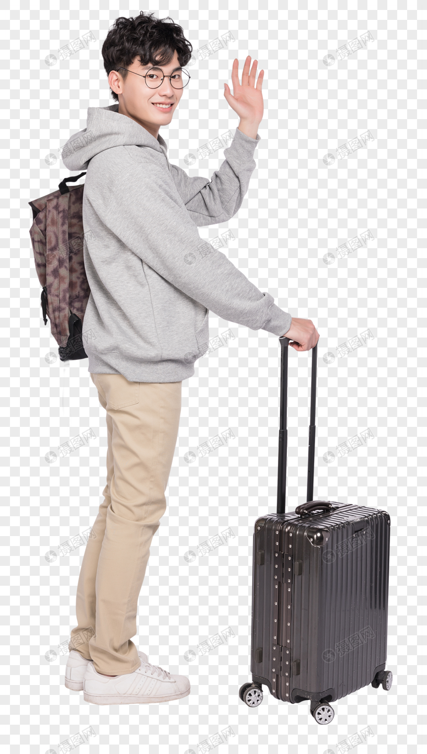 拉着行李箱打招呼的年轻人图片