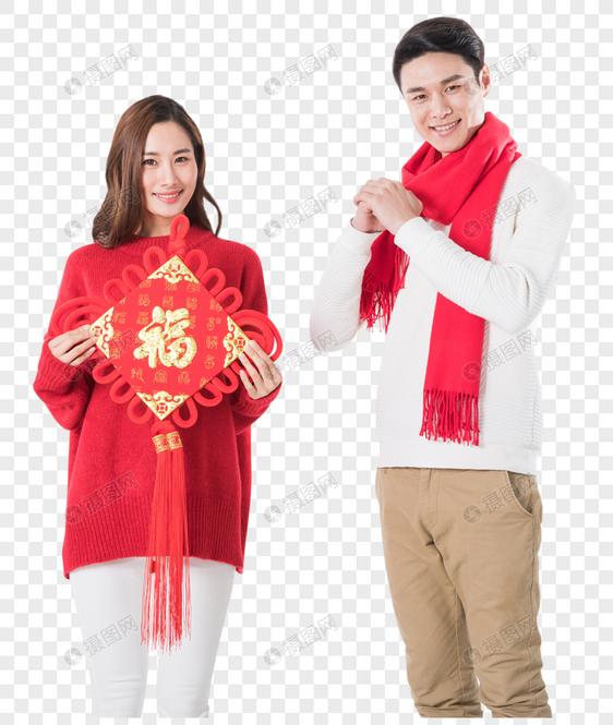 年轻夫妻拿着新年中国结图片