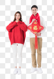 年轻夫妻拿着新年中国结图片