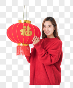 提着红灯笼的年轻女性图片