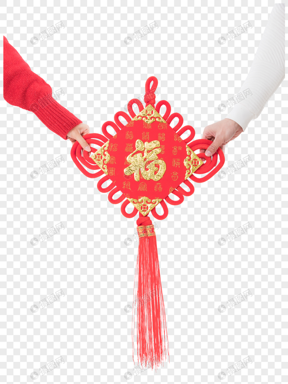 年轻夫妻拿着新年中国结图片