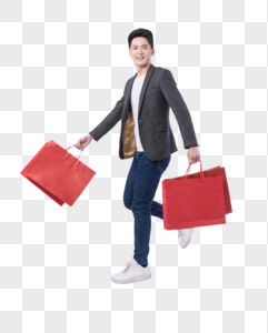提着购物袋开心购物的年轻男子高清图片