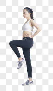 抬腿运动的健身女性图片