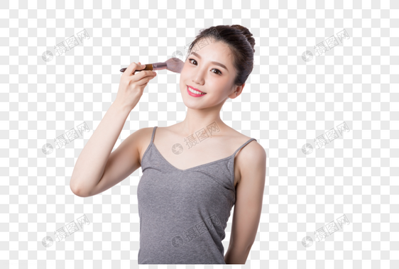 美丽女孩手拿粉刷化妆图片