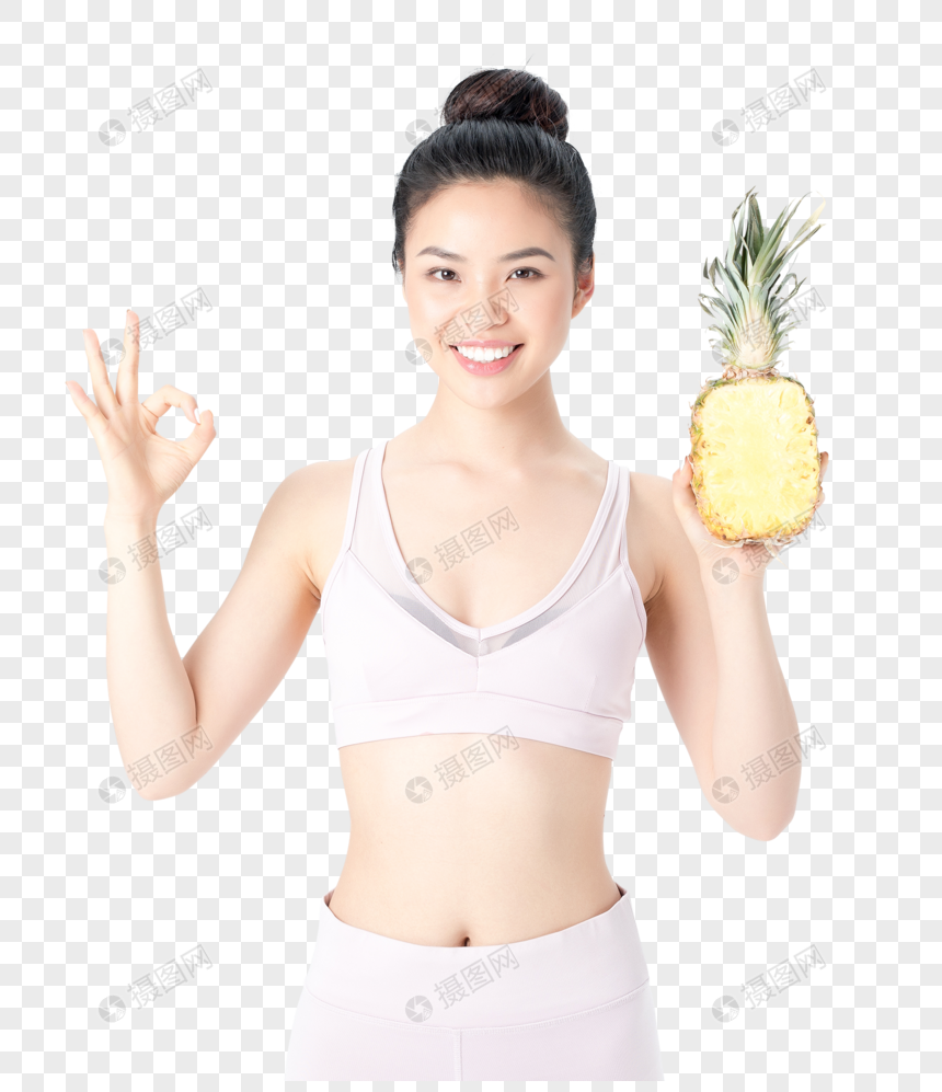 运动健身美女手拿菠萝图片