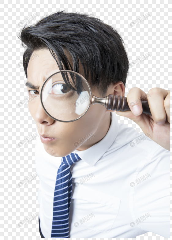 商务男性手拿放大镜观察