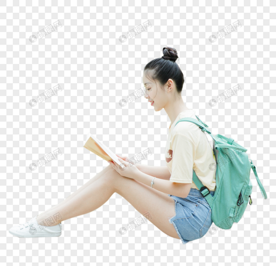 坐在地上看书的女生侧面图片