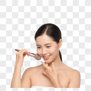 美女用化妆刷涂腮红图片