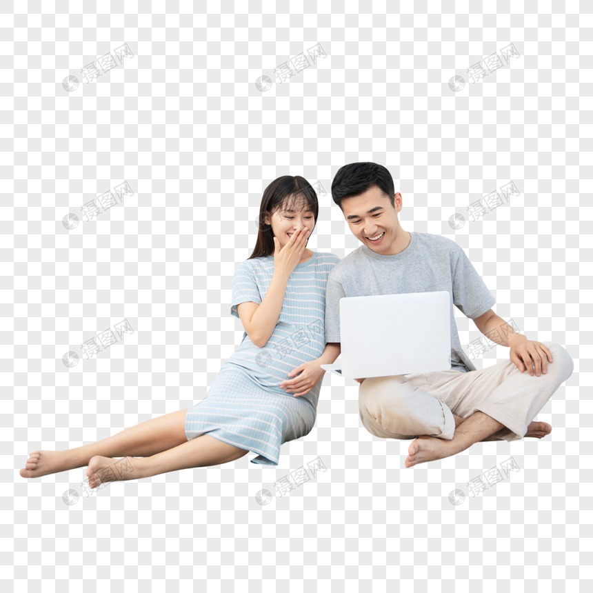 孕妇和丈夫一起在卧室地毯上看电脑图片