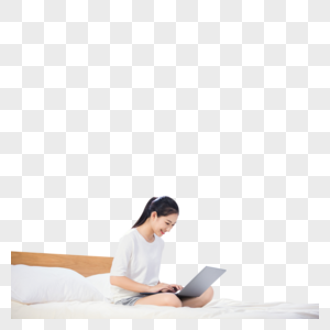 女性坐在床上使用电脑图片