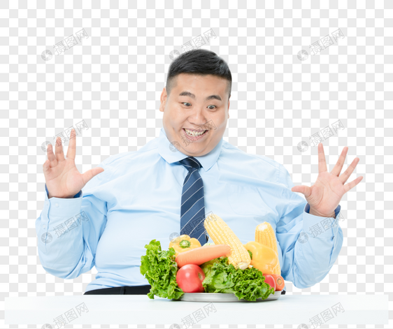 肥胖商务男性吃蔬菜图片