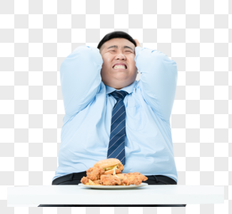 肥胖商务男性吃炸鸡高清图片