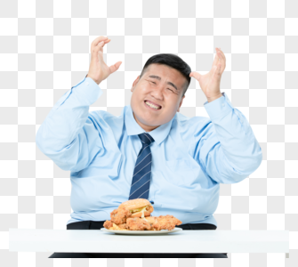 肥胖商务男性吃炸鸡高清图片