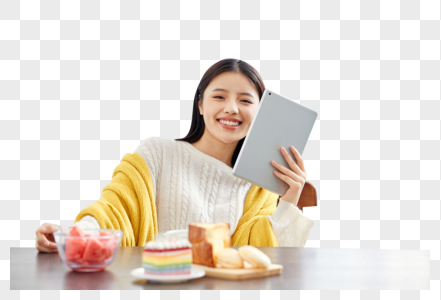 居家美女吃早餐玩平板电脑图片