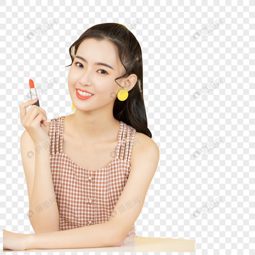 涂抹口红的甜美女性图片