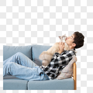 坐在沙发上抱着猫的男孩图片