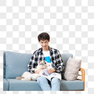 抱着宠物猫看书的青年男性图片